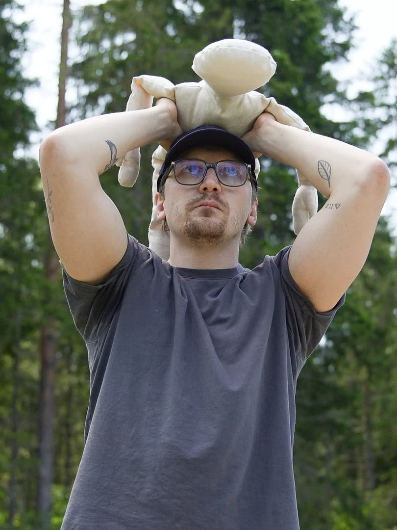 Parent lifting baby overhead for shoulder sit