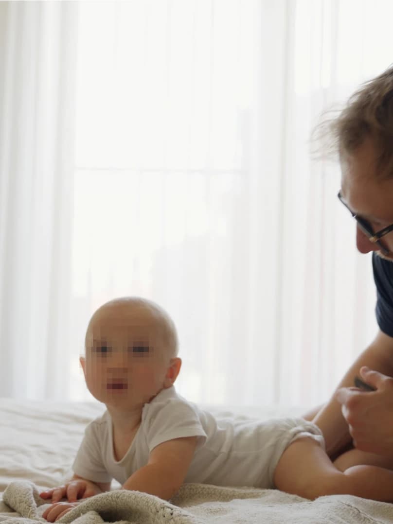 Baby doing tummy time on a soft surface