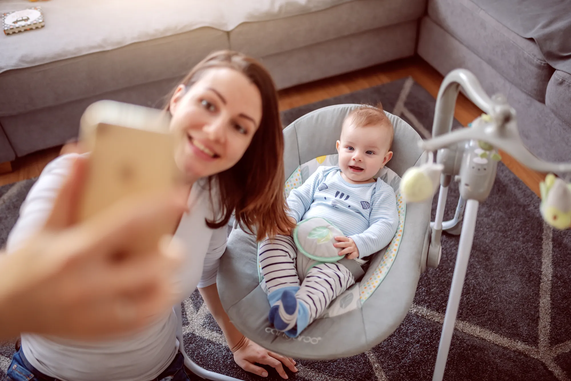 Mother taking selfie with baby